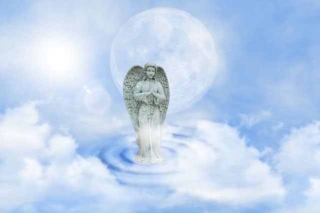 guardian-angel-statue-blue-sky-clouds-small