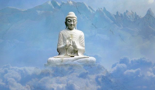 buddha-staute-sitting-cross-legged-behind-clouds_small